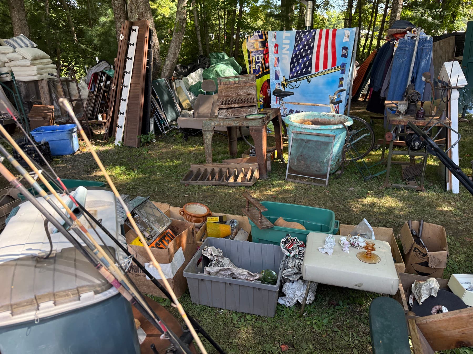 A pile of vintage furniture and finds waiting to be sorted at Brimfield
