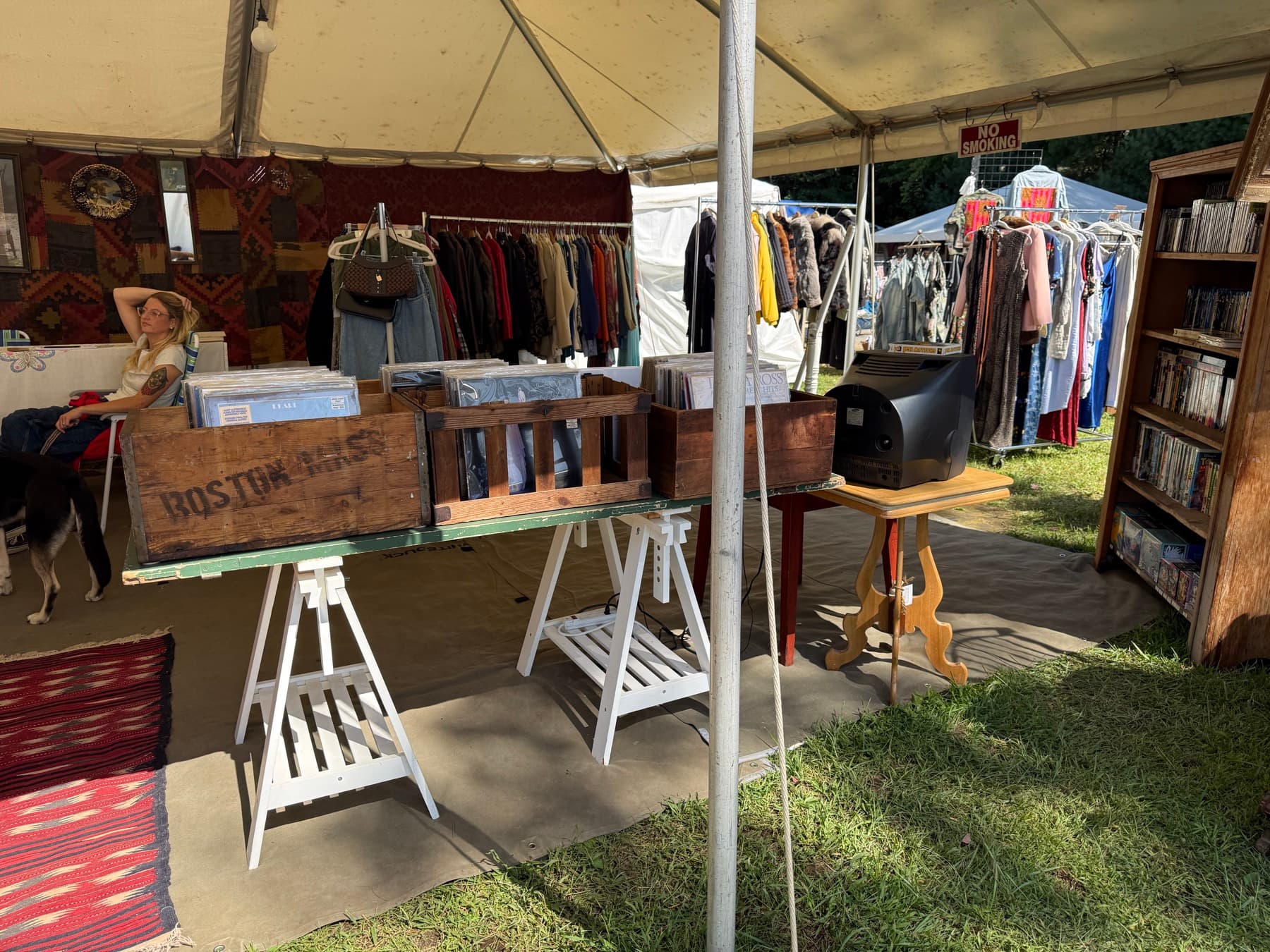 Wooden crates stamped Boston Mass full of vinyl records at a Brimfield booth